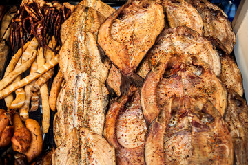 Fresh smoked fish in the market close up shot.