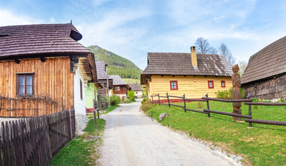 Fototapeta na wymiar Colourful traditional wooden houses in mountain village Vlkolinec- UNESCO (SLOVAKIA)