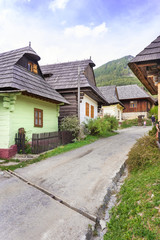 Obraz premium Colourful traditional wooden houses in mountain village Vlkolinec- UNESCO (SLOVAKIA)