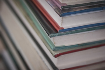 Old reading books stacked on a warehouse floor