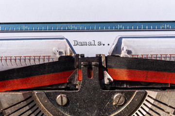 Typewriter with a sheet and the text Damals (at that time)
