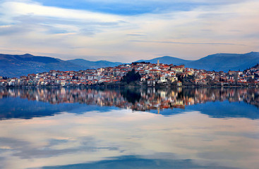 Kastoria town reflected on the waters of Orestiada lake, Western Macedonia, Greece.