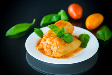stuffed pepper with meat and vegetable sauce in a plate