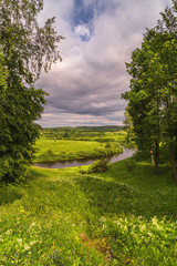 Summer landscape with river and field