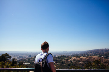 young man on top of the mountain