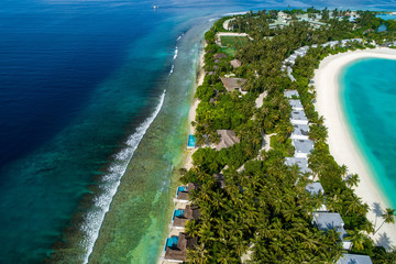 Aerial view of beautiful island at Maldives in the Indian Ocean. Top view from drone.