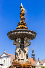 Obraz premium Main square with Samson fighting the lion fountain sculpture and bell tower in Ceske Budejovice. Czech Republic.