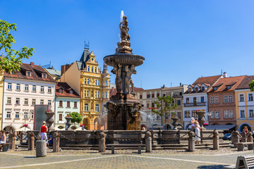 Obraz premium Main square with Samson fighting the lion fountain sculpture and bell tower in Ceske Budejovice. Czech Republic.