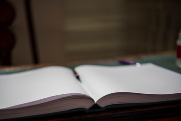 Opened book on the table. Close up.