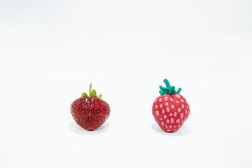 Comparison of two strawberries - Real and Fake.