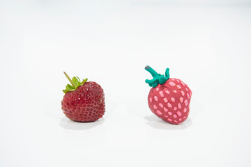 Comparison of two strawberries - Real and Fake.