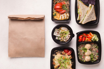 Healthy food delivery in black boxes ready to be send