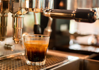 Close up of coffee machine is preparing coffee in coffee shop