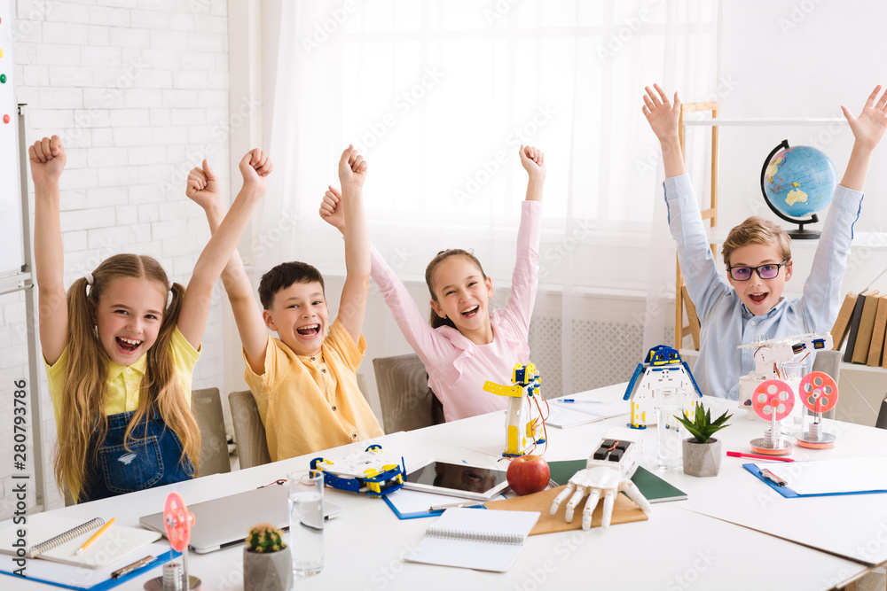 Poster happy classmates rejoicing with raised hands after stem class