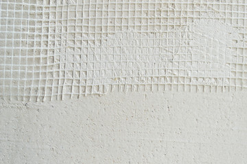 Putty wall reinforced with mesh.
