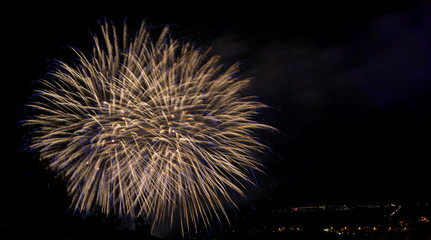 Fototapeta premium Fireworks bursting in city
