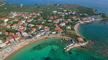 Aerial drone panoramic photo of iconic picturesque village and sandy beach of Stoupa in the heart of Messinian Mani, Peloponnese, Greece