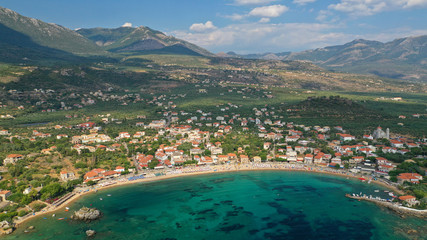 Fototapeta na wymiar Aerial drone panoramic photo of iconic picturesque village and sandy beach of Stoupa in the heart of Messinian Mani, Peloponnese, Greece