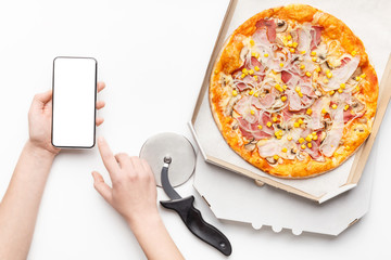 Courier holding phone with hot pizza nearby - Powered by Adobe
