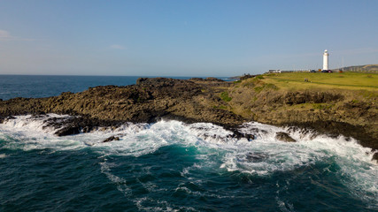 Naklejka na ściany i meble A view from Kiama Blow Hole Point on the south coast of New South Wales, Australia. In aboriginal the word Kiama means ‘where the ocean makes noise’.