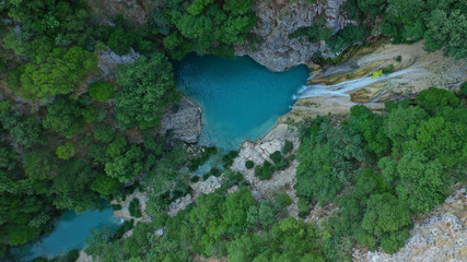 Naklejka na ściany i meble Aerial drone photo of famous mountain lake and waterfall in Polilimnio area in Messinia, Peloponnese, Greece