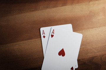 Poker Chips with Playing Cards on a Beautiful Wooden Table