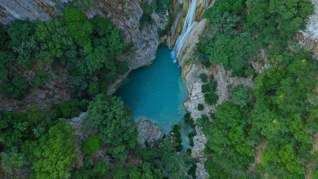 Aerial drone photo of famous mountain lake and waterfall in Polilimnio area in Messinia, Peloponnese, Greece