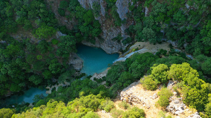 Aerial drone photo of famous mountain lake and waterfall in Polilimnio area in Messinia, Peloponnese, Greece