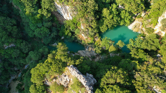 Aerial drone photo of famous mountain lake and waterfall in Polilimnio area in Messinia, Peloponnese, Greece