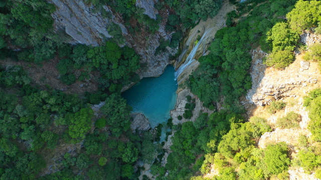 Aerial drone photo of famous mountain lake and waterfall in Polilimnio area in Messinia, Peloponnese, Greece