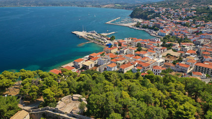 Fototapeta premium Aerial drone photo of iconic medieval castle and village of Pylos or Pilos in the heart of Messinia prefecture, Peloponnese, Greece