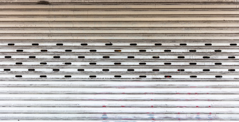 Old metal roller shutter texture background, white color