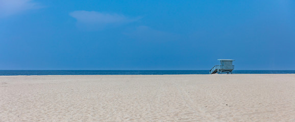 Lifeguard hut on Santa Monica beach. Pacific ocean coastline Los Angeles USA.