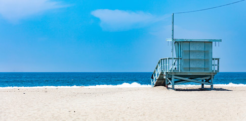 Lifeguard hut on Santa Monica beach. Pacific ocean coastline Los Angeles USA.