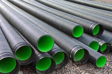 Large corrugated PVC pipes for drainage. Corrugated water pipes of large diameter prepared for...