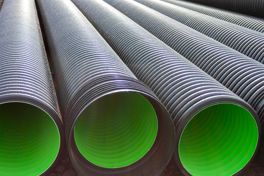 Large corrugated PVC pipes for drainage. Corrugated water pipes of large diameter prepared for laying.