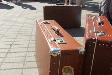 a brown bag with buckles on the street