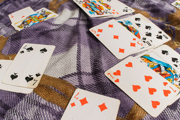 Playing cards lying on a wooden table