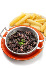 Small octopus stewed with fried potatoes. Portuguese dish.