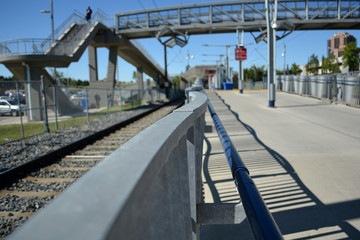 Pedestrian transit train track line at city station.