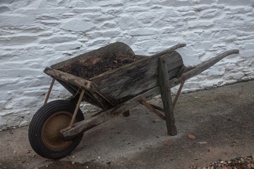 An old wheelbarrow in wood