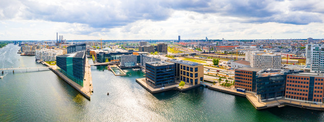 Beautiful aerial view of the new modern district in Copenhagen, with glass skyscrapers, office...