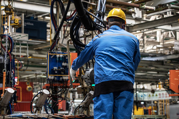 Workers in machinery factory in China.