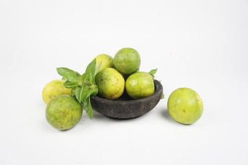 limes and lemons on a table
