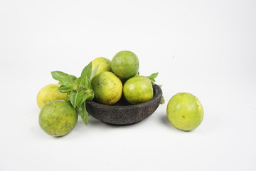 limes and lemons on plate