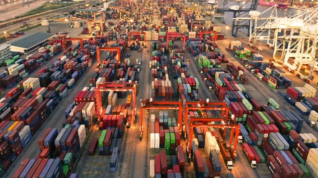 Time laps smart logistic and smart Cargo container ships loading cargo with cranes at container depot.