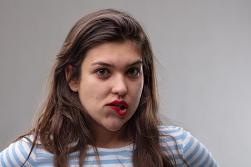 Undecided young woman with a moral dilemma