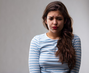 Anxious worried moody young woman