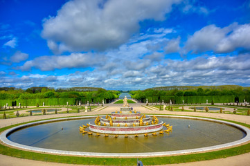 Versailles, France - April 24, 2019: Fountain of Latona in the garden of Versailles Palace on a...