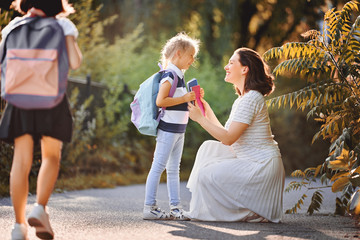 Parent and pupils go to school